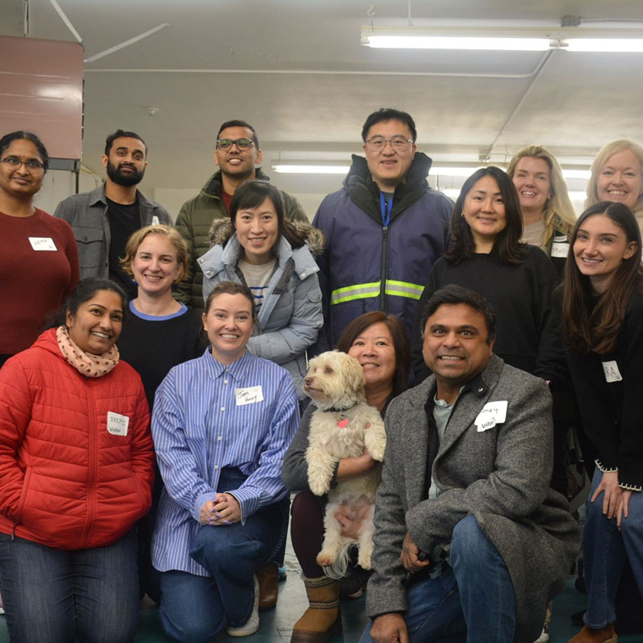 Team Group of team members wearing name tags facing the camera